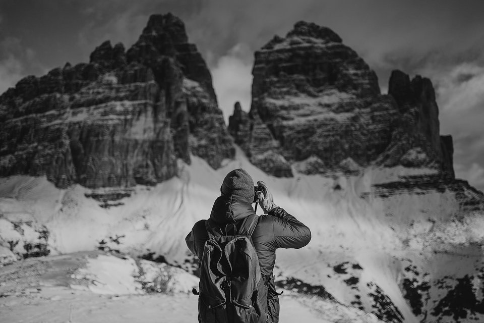 Photographer shooting in the Dolomites mountains