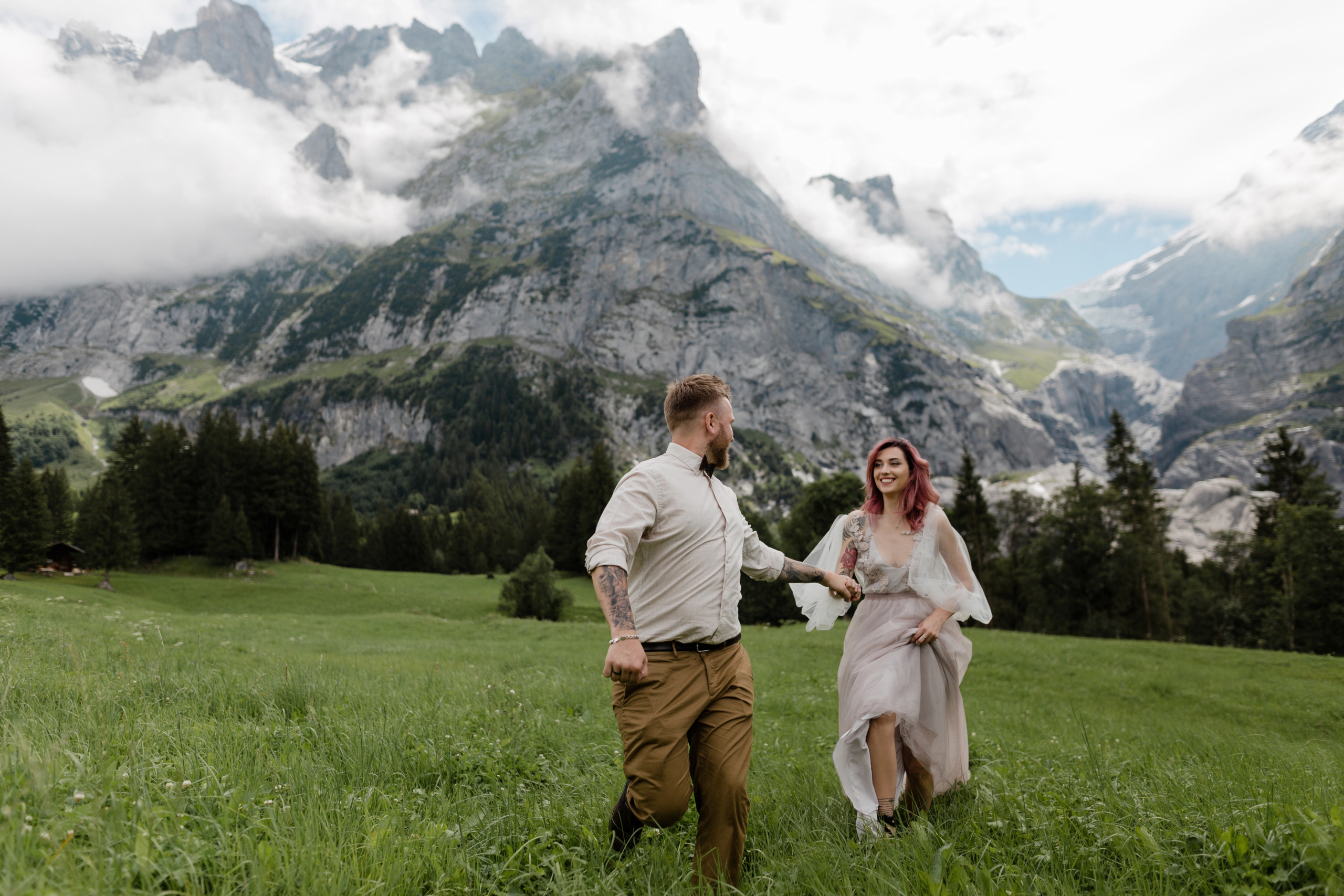 A bride and groom photographed in the mountains at a destination wedding